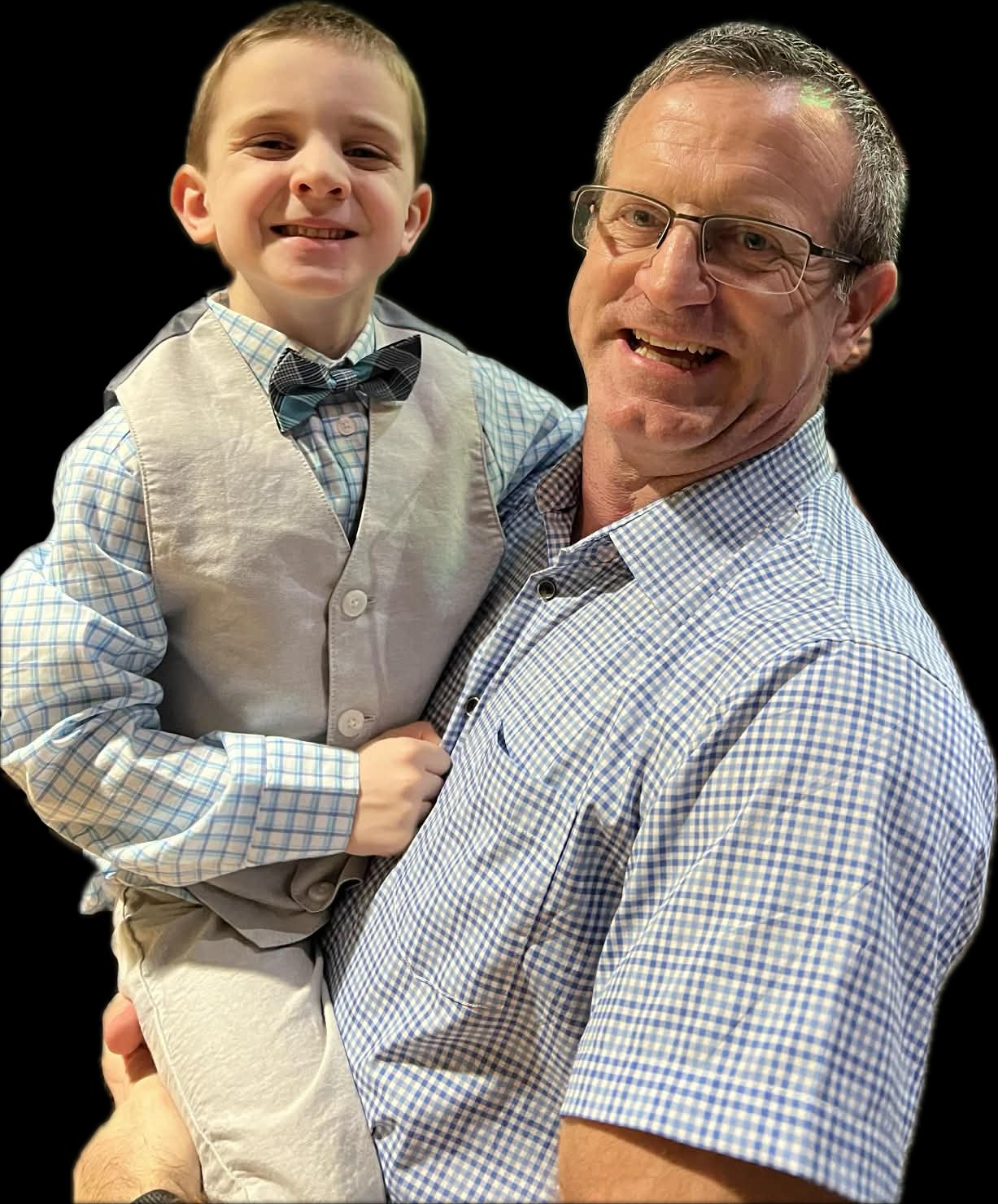 Michael Blair, FNP-C, founder of Blair Family Health, holding his son